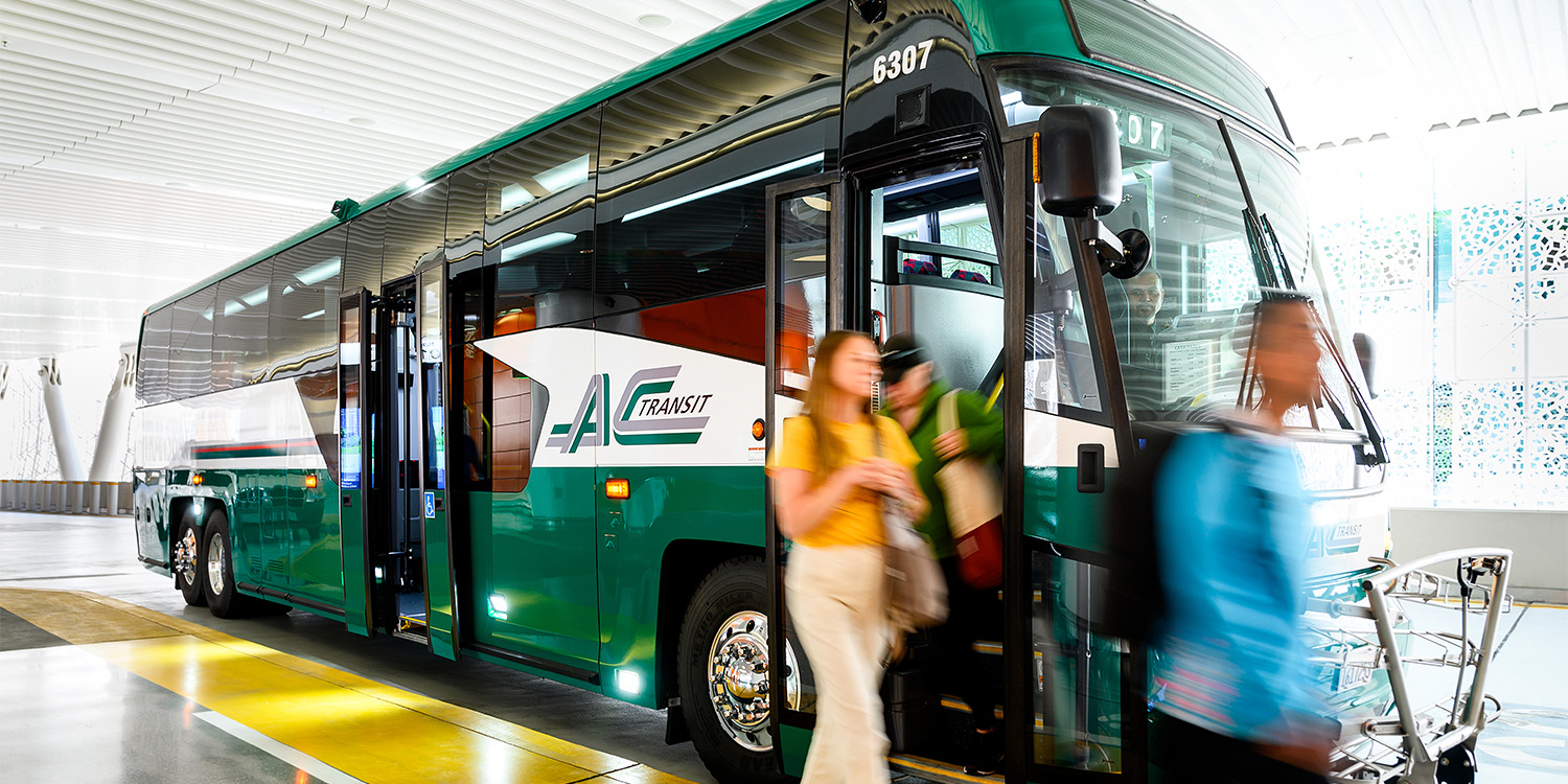 Group of riders off-boarding an AC Transit bus