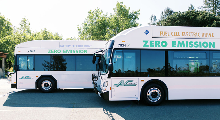 Two zero emission buses parked next to each other