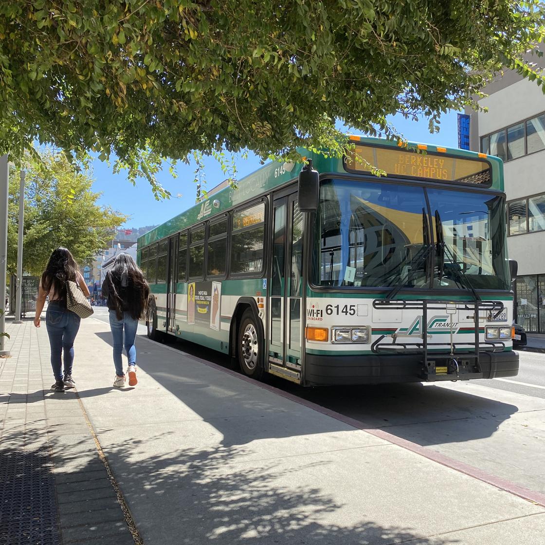Line F parked in Berkeley, with two students walking by