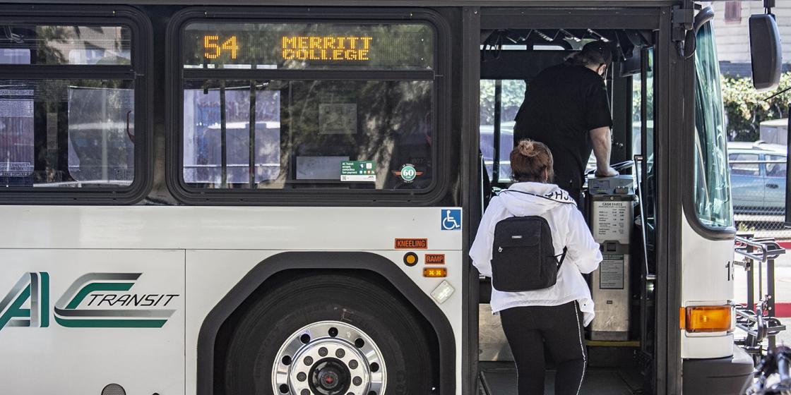 Woman boarding bus