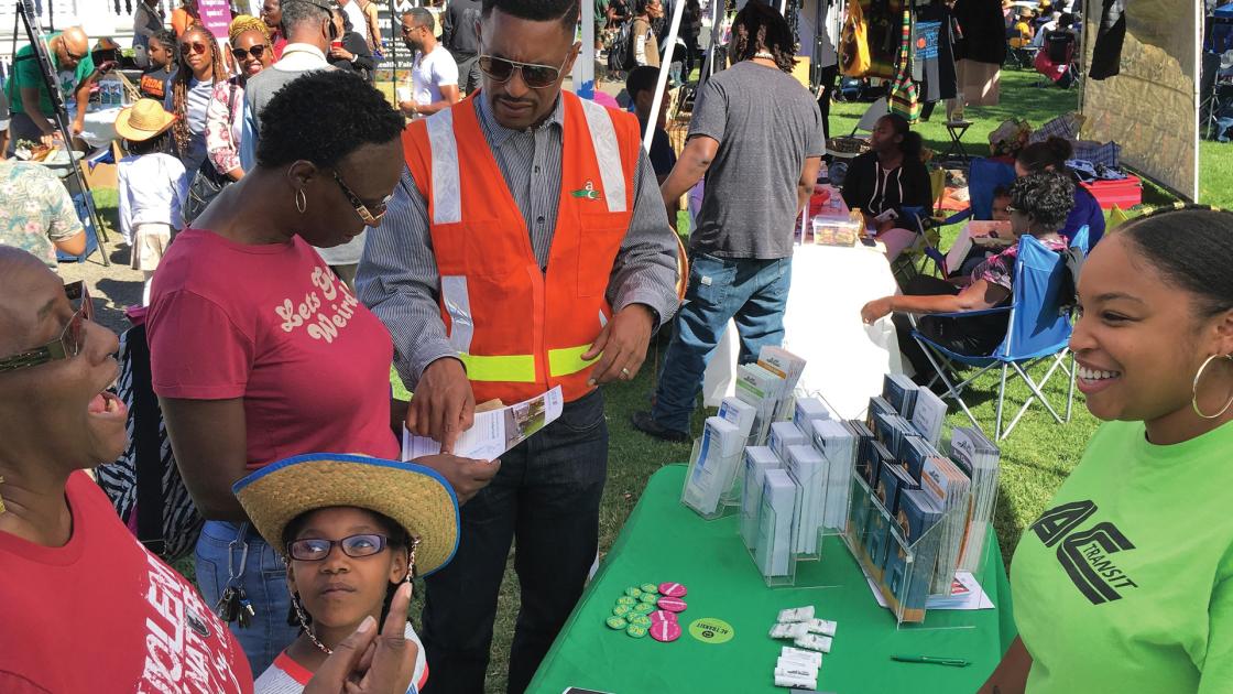 AC Transit staff talking with riders