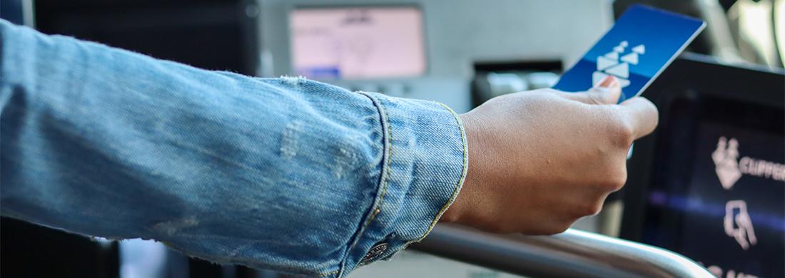 Rider tapping Clipper Card to Clipper reader