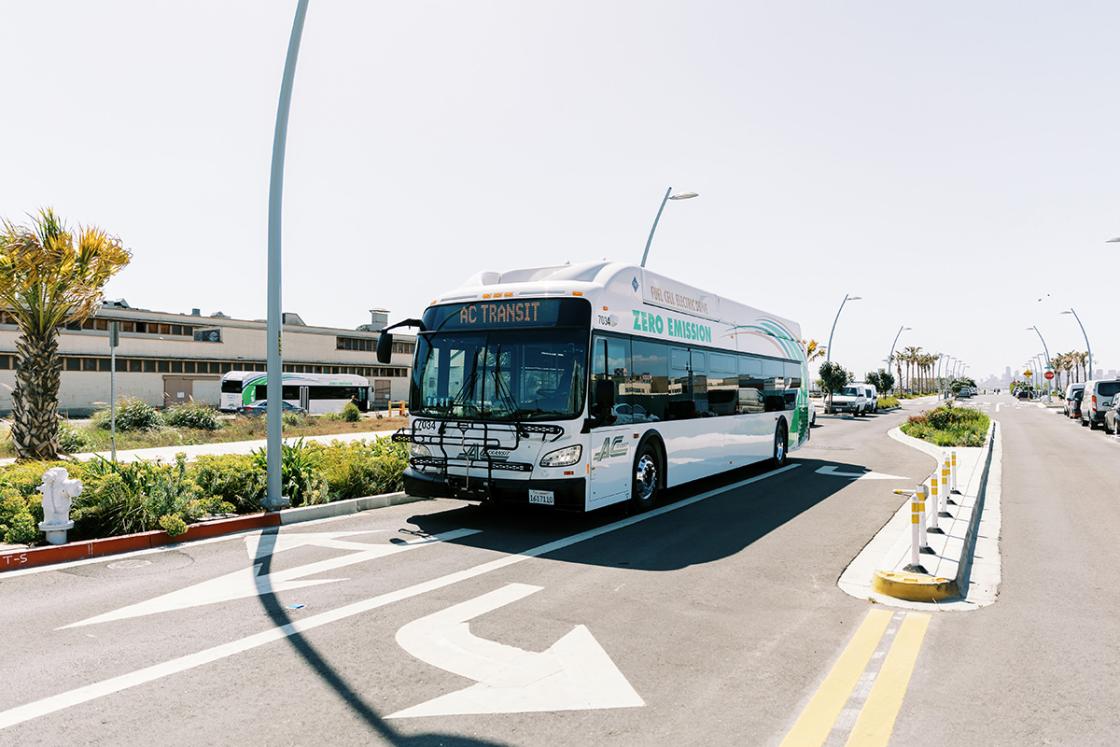 AC Transit bus driving down a street in Alameda