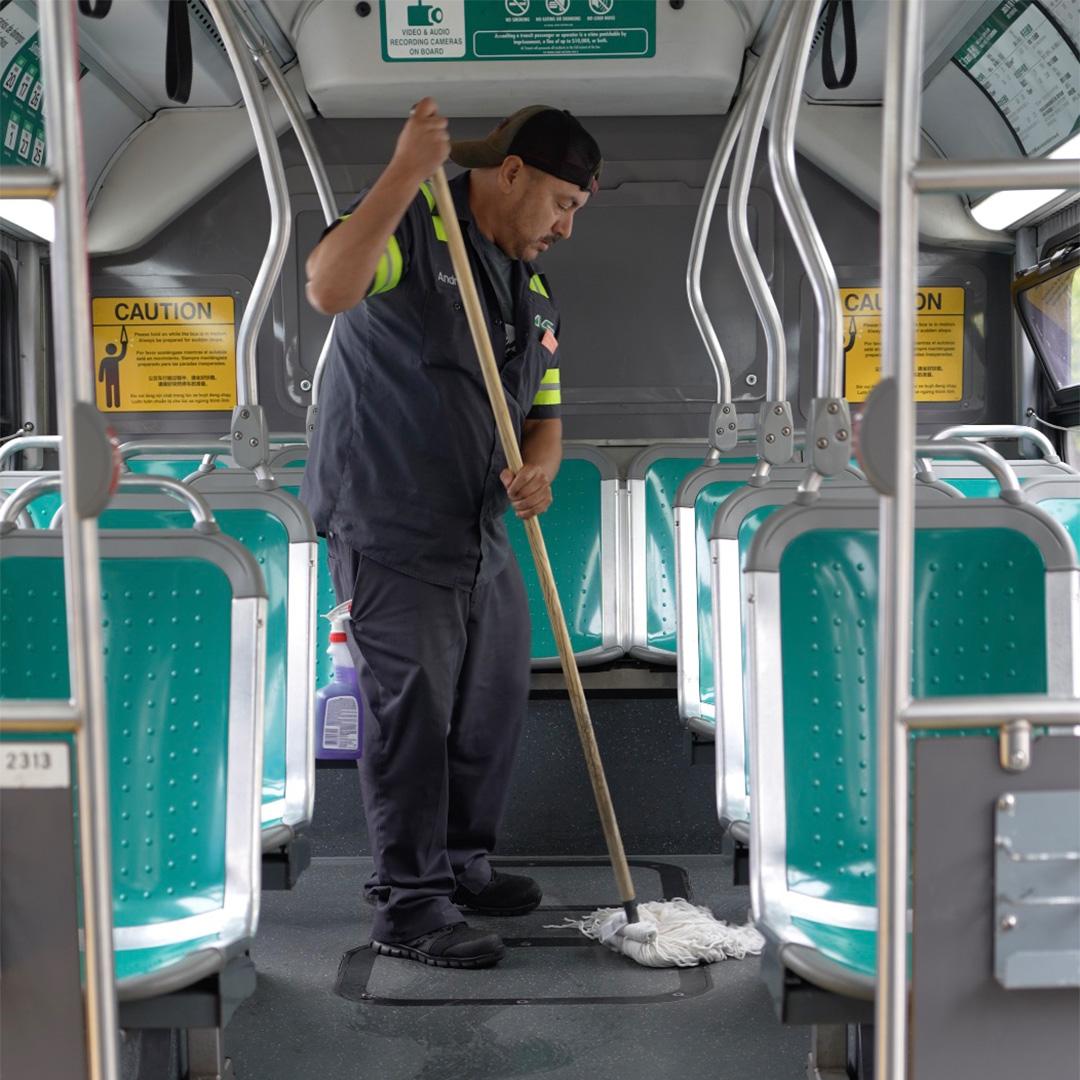 AC Transit employee cleaning coach