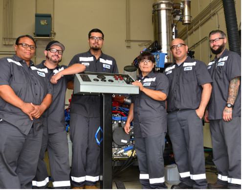six maintenece team workers pose for the camera